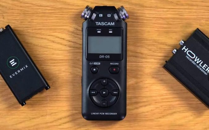 Three external recording devices lay next to each other on a well-lit wooden surface. On the left is an Evermixbox5, in the middle is a Tascam DR-05, and on the right is a Howler box.