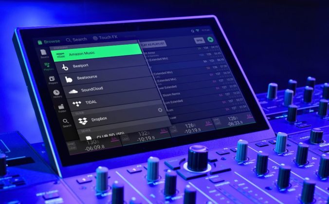 Close-up of a DJ controller screen displaying streaming options like Amazon Music, SoundCloud, and Tidal, with illuminated control knobs.