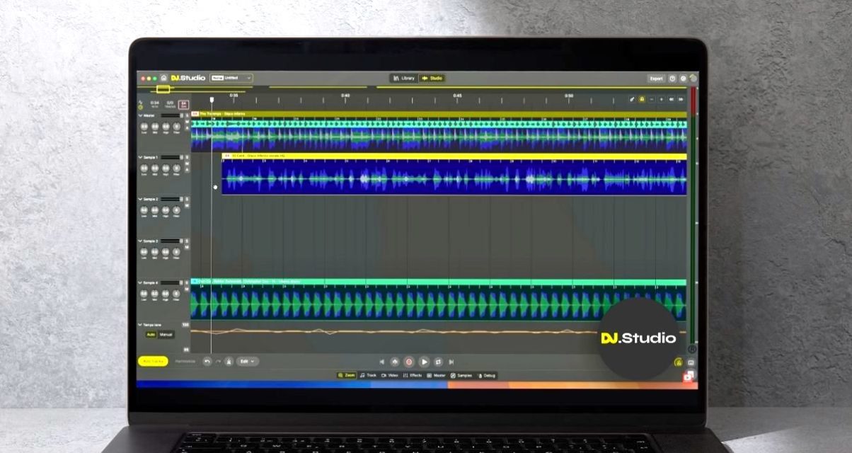 A laptop sits against a steel grey wall. On the screen is DJ.Studio software showing it's new Mashup Mode. In the bottom right-hand corner is a circle logo with the software name.