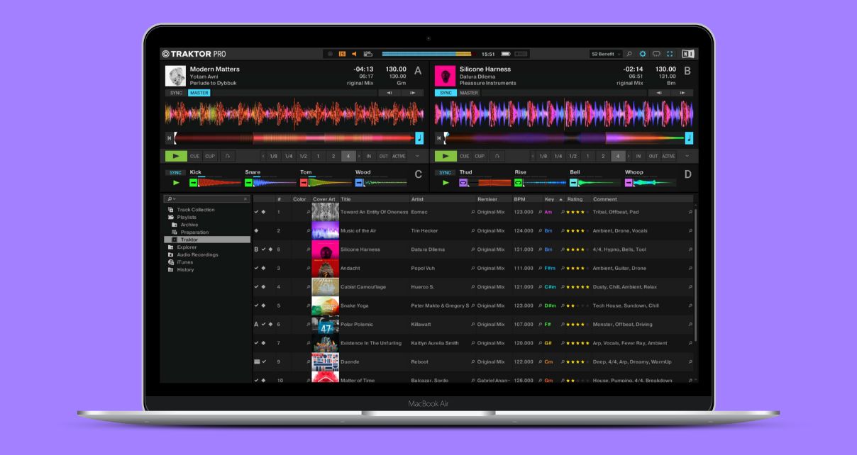 A silver laptop displaying Traktor Pro software against a purple background.