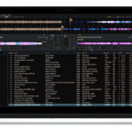 A silver laptop displaying Mixxx DJ software on a transparent background.