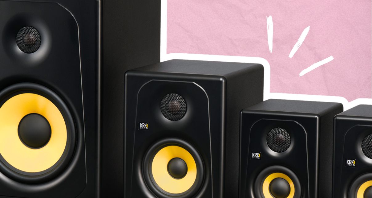 4 black and yellow KRK Kreate series monitors of different sizes lined up next to other with a white outline. The background is light pink with a slightly wrinkled texture that resembles paper. There are three white highlight lines drawing attention to the monitors.