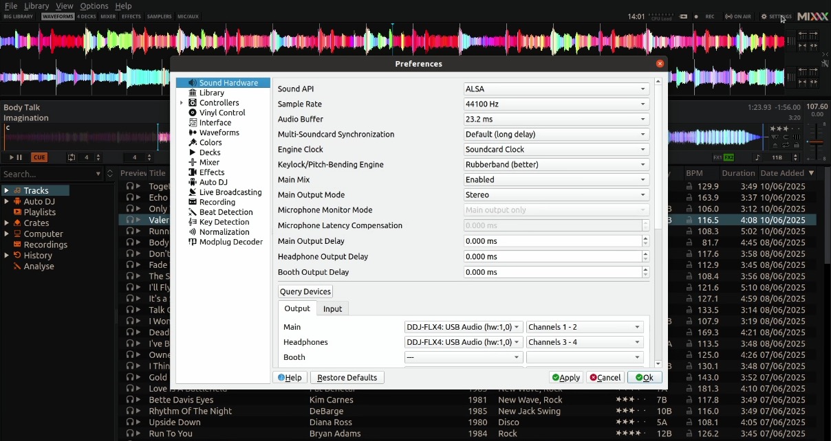 Screenshot of the Mixxx DJ software preferences menu, displaying audio settings and track information with waveform visualisations above.
