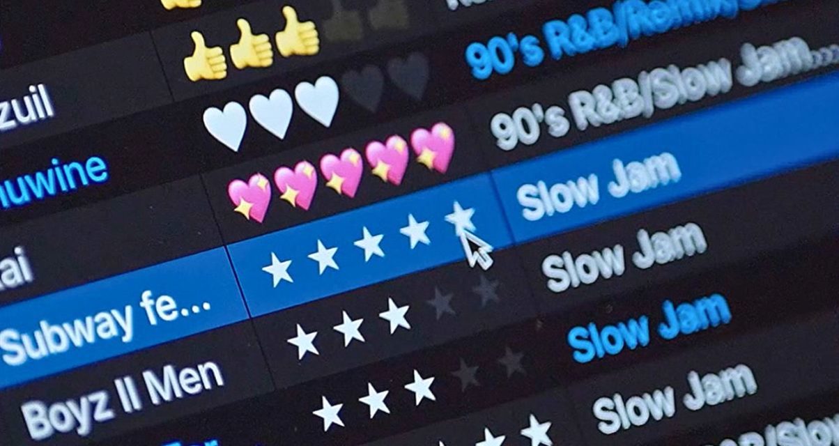 Close up of the Serato DJ 4.0 music library. The screen displays a music playlist with various emoji ratings, highlighting titles like "90's R&B/Slow Jam" and a rating system with stars.