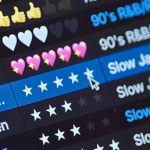Close up of the Serato DJ 4.0 music library. The screen displays a music playlist with various emoji ratings, highlighting titles like "90's R&B/Slow Jam" and a rating system with stars.