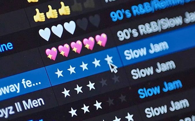 Close up of the Serato DJ 4.0 music library. The screen displays a music playlist with various emoji ratings, highlighting titles like "90's R&B/Slow Jam" and a rating system with stars.