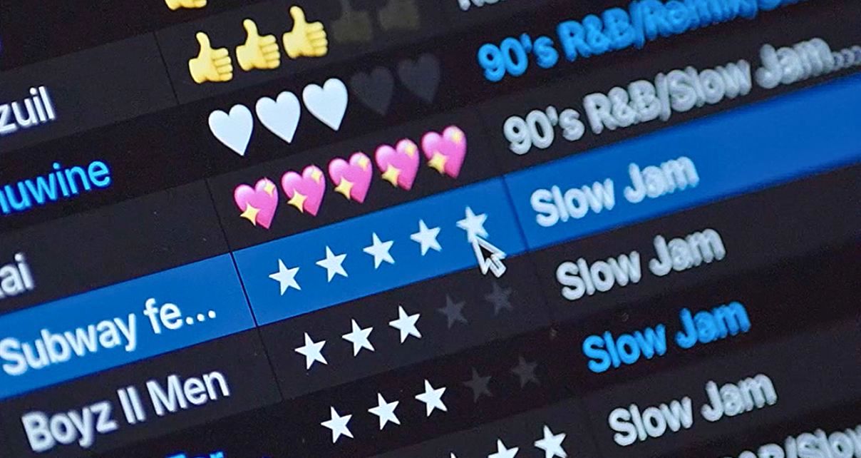 Close up of the Serato DJ 4.0 music library. The screen displays a music playlist with various emoji ratings, highlighting titles like "90's R&B/Slow Jam" and a rating system with stars.