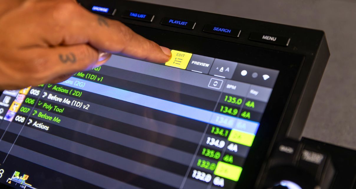 A person taps the Playlist Edit button on a CDJ-3000x media player. 