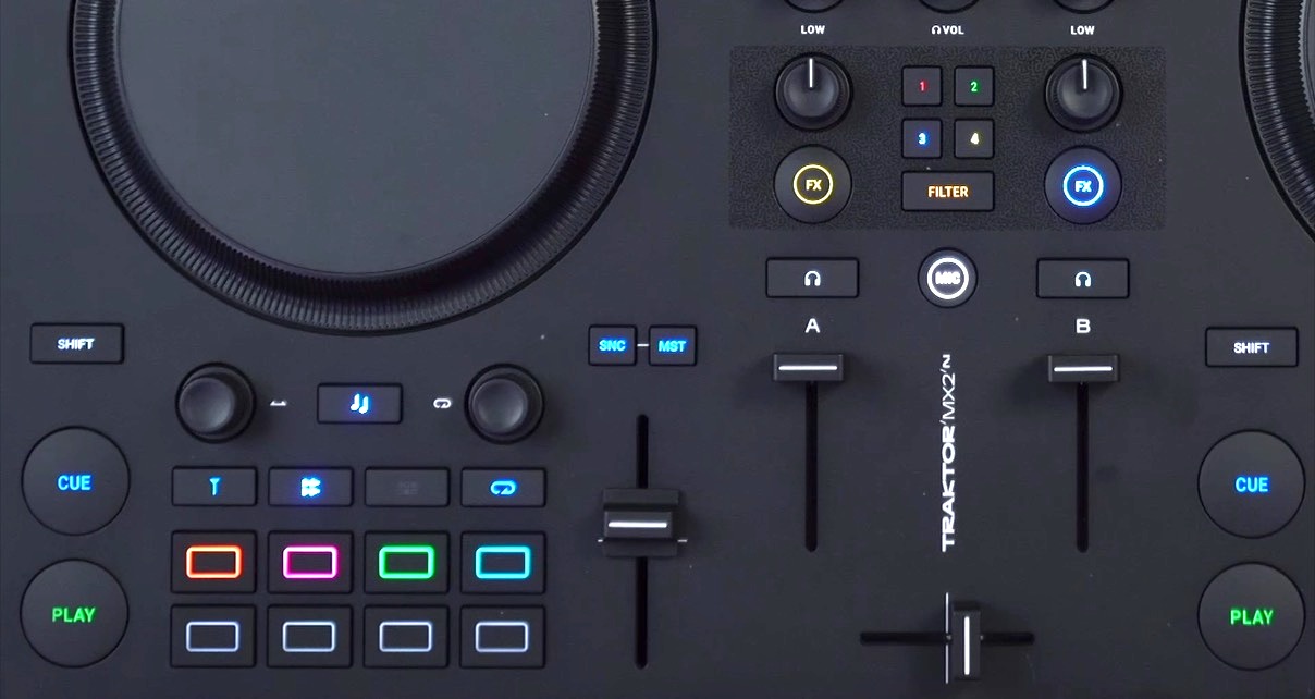 Close up of the pad and jogwheel section on a Traktor MX2 DJ controller. 