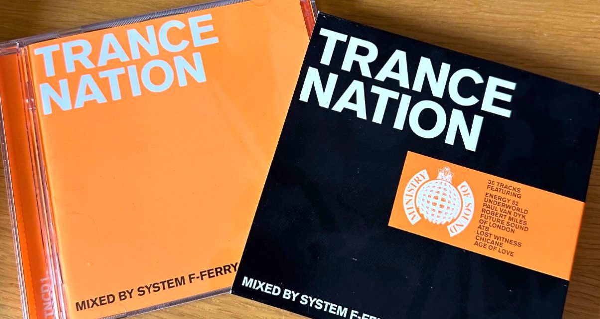 Orange, black and white Trance Nation CD and sleeve side by side on a light wooden desk.