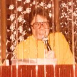 Student Spotlight: How A 72-Year-Old Musician Rediscovered DJing After 45 Years A photo of David Franks. He has longer, light brown hair, big glasses, and is wearing headphones and a light orange turtleneck. He's standing behind a DJ booth and holding up a microphone to speak.