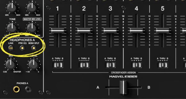 Zoomed in on a black DJ mixer to highlight the headphones section. There is a yellow circle highlighting the mono split button. 