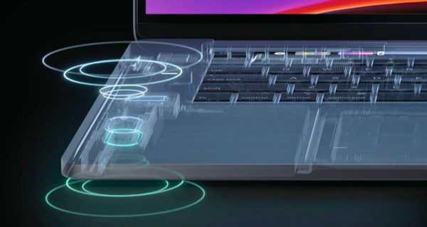 This photo is zoomed in on a silver laptop with sound wave graphics emanating from the corner to indicate laptop speakers. 