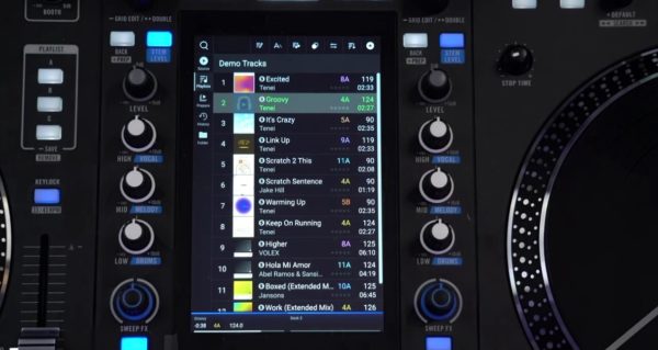 The Rane System One's vertical touchscreen showing the Engine DJ playlist view with the "Demo Tracks" playlist open, displaying track names, BPMs, keys, and durations.