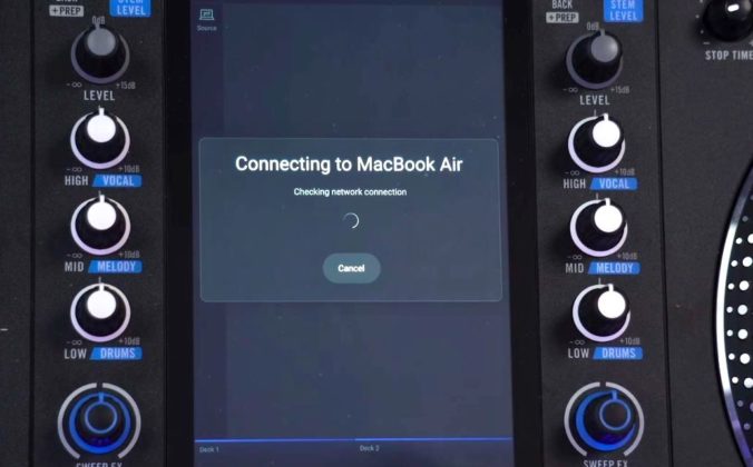 Zoomed in view of a Rane System One screen that reads "Connecting to MackBook Air" with a loading circle icon.